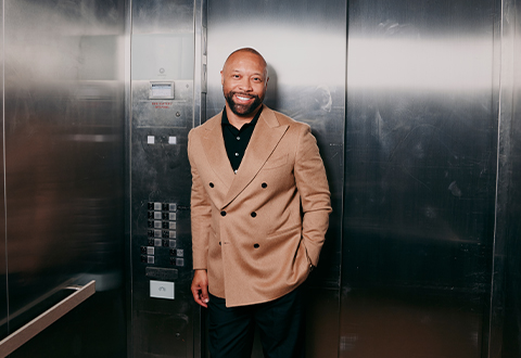 Paul Judge posing in an elevator