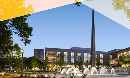 Photo of two people with campus background