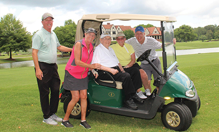 three people playing golf with Fred Lenoue