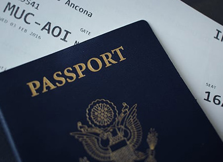Photo of passport and plane ticket