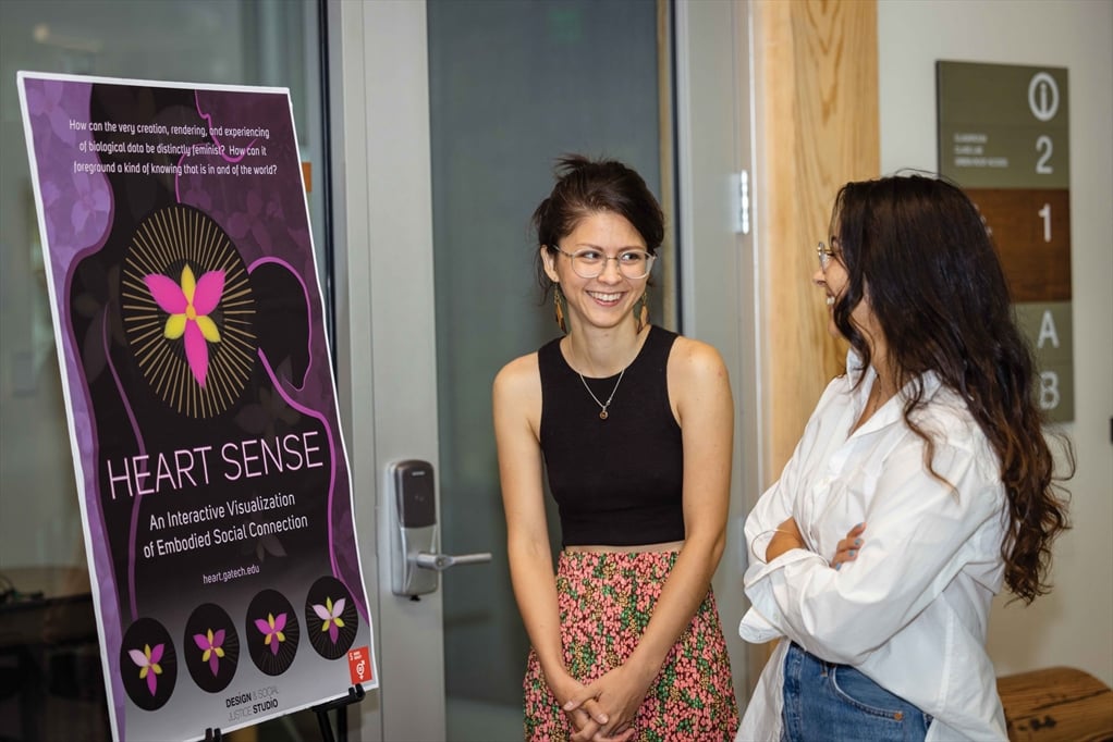 Photo of Sylvia Janicki talking to someone