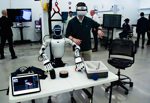 A man testing out a robot