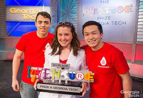 Three members of the AmenoCheck team hold the InVenture Prize. 