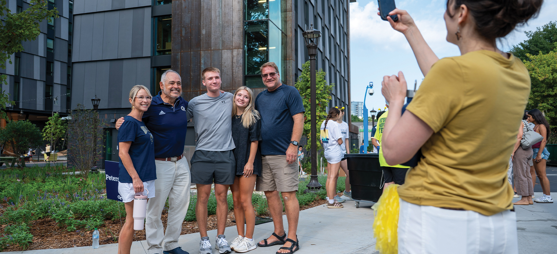 Angel Cabrera poses with students moving in.