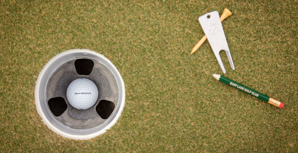 graphic of golf ball and hole