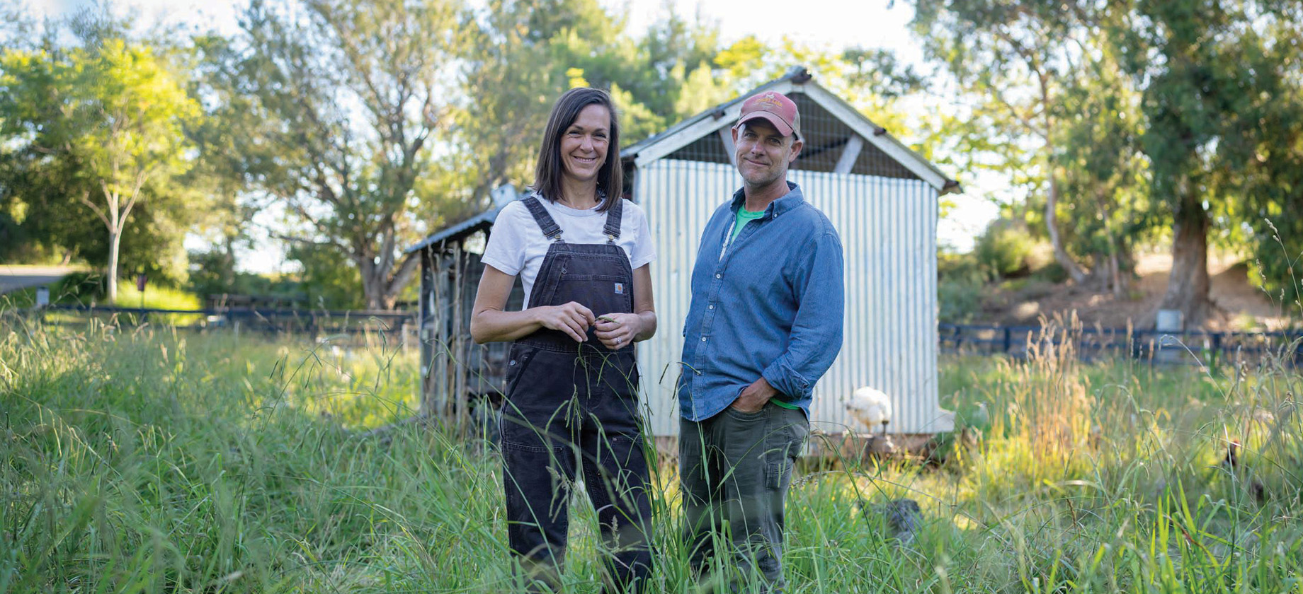 Photo of a a couple standing in a field