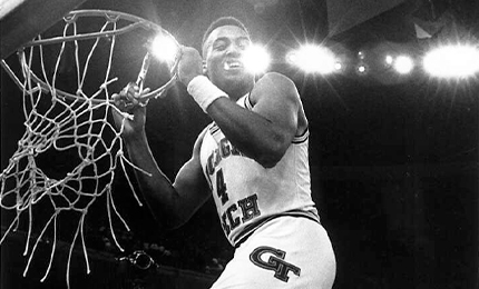 Dennis Scott dunking a basketball
