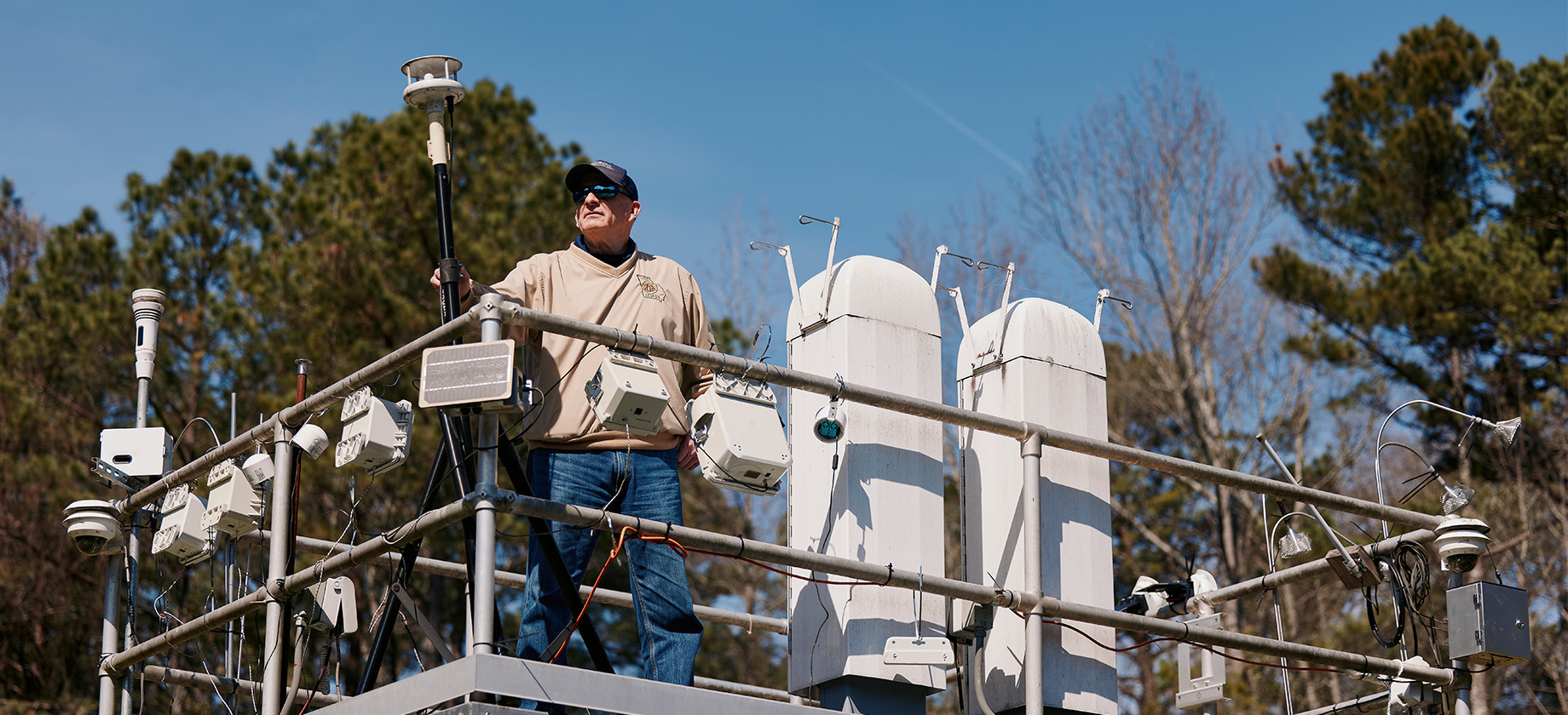 Man standing on weather technology equipment