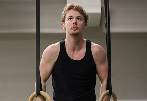 collage of david lloyd george doing muscle ups