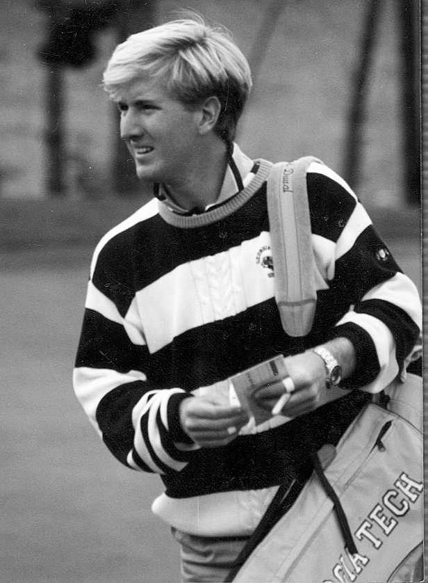 Duval carrying his golf bag