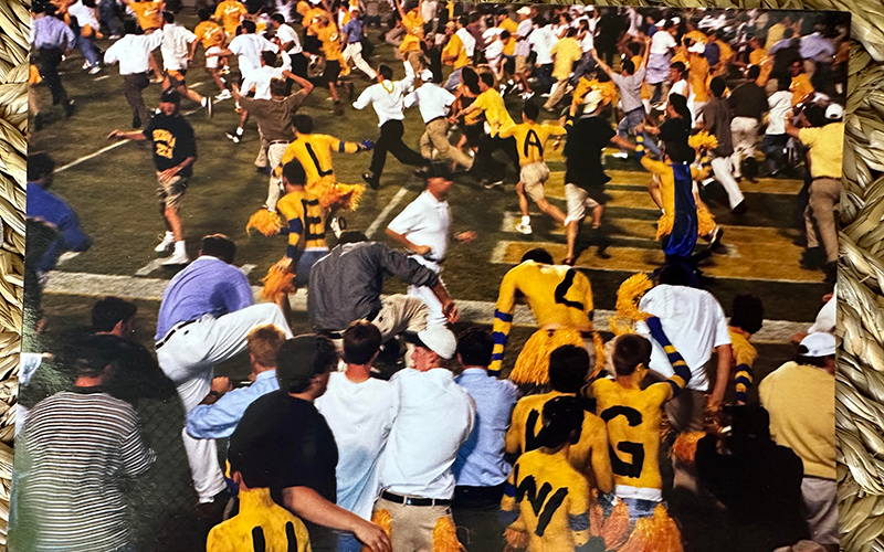 The Goldfellas rushing on to the field