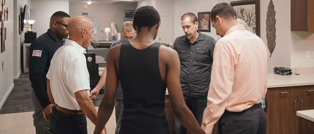 Members of the Hope's Path pray together