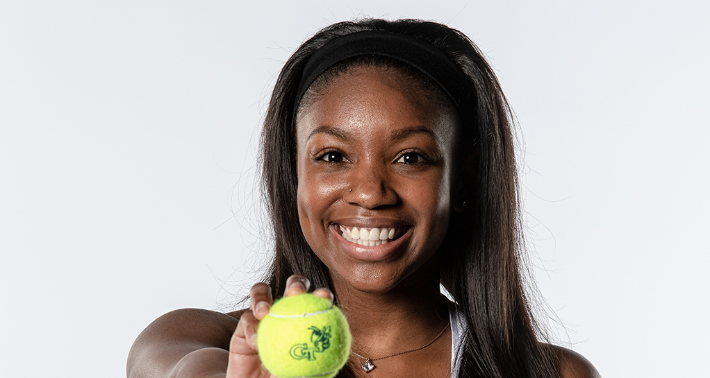 Picture of Kenya Jones with a tennis ball