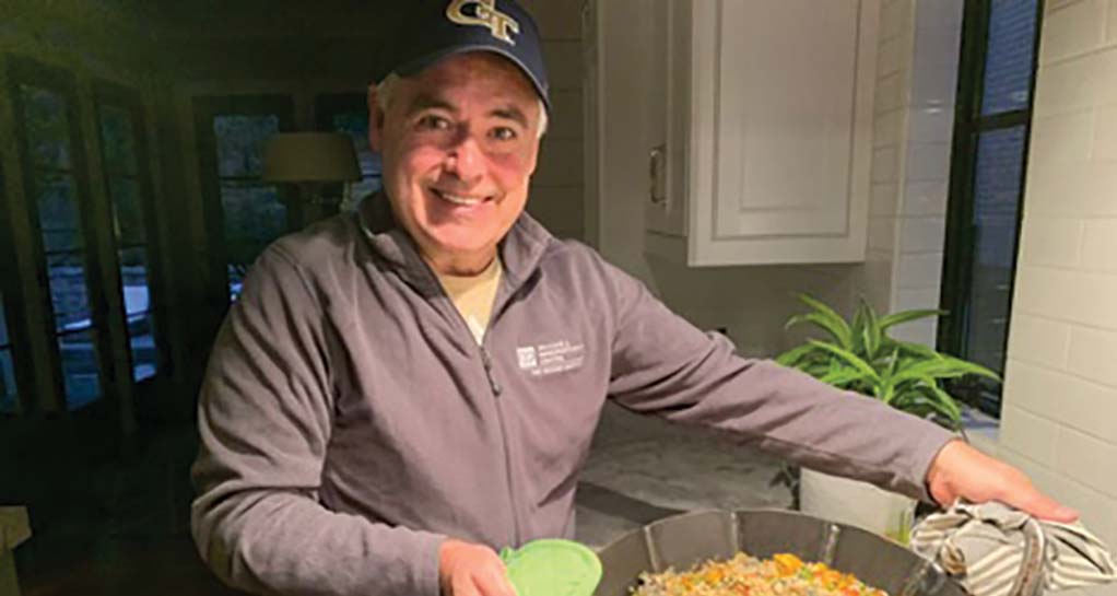 President Cabrera cooking paella