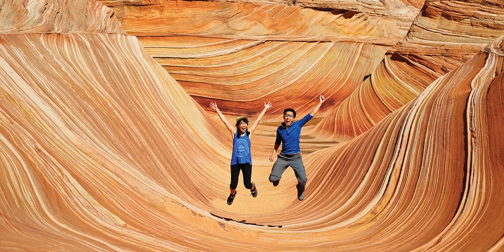Esther and Jacob jumping for a picture